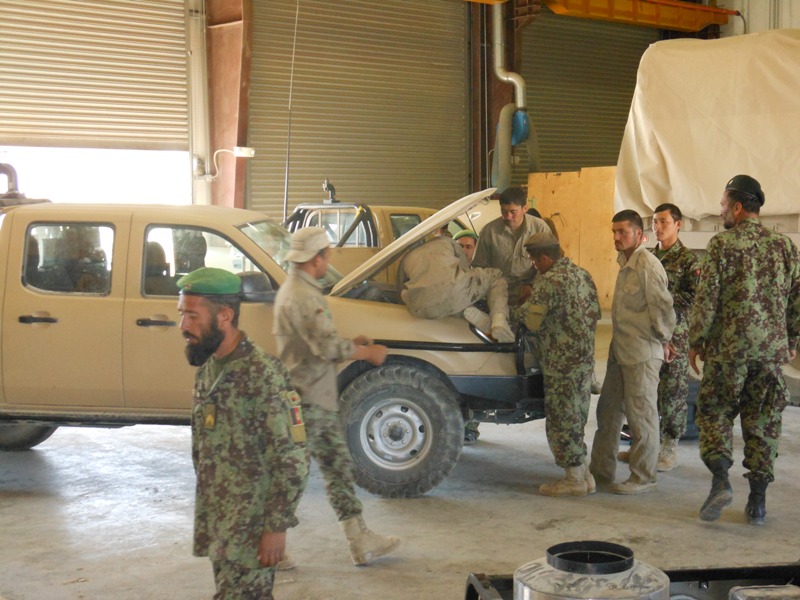 Regional Logistics Support Command – Southeast Maintenance Company commander Capt. Zebullah supervises his mechanics as they repair a 203rd Corps Ford Ranger at the Regional Logistics Support Command – Southeast - Gardez Motor Pool. Sept. 3rd. (U.S. Army photo by Capt. Randy Myers, RLSC-SE, NTM-A )