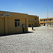 A soldier walks the new construction at Kandahar Air Field (12 Jun 2010)