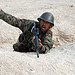 Afghan National Army Basic Warrior Trainee simulates throwing a hand grenade (13 Oct 10)