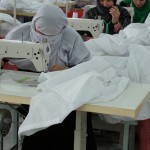 Women at the Afghan women owned business Meca-Clydesdale sew bed sheets at their factory in Kabul, Afghanistan.  Contracting with Afghan Women Owned Businesses is a Coalition initiative to increase training and education of Afghan women. Meca-Clydesdale provides Afghan made textiles to the Afghan National Army, Afghan National Police and other governmental organizations. (Official U.S. Navy photo by LT Russell Wolfkiel/Released)