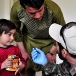 — An Afghan National Army medic tells an Afghan girls father about the medicine he prescribed for her. NTM-A is a coalition of 37 troop-contributing nations charged with assisting the Government of the Islamic Republic of Afghanistan in generating a capable and sustainable Afghan National Security Force ready to take lead of their country's security by 2014. For more information about NTM-A, visit www.ntm-a.com. (U.S. Navy photo by Mass Communication Specialist 3rd Class Eric Lockwood)