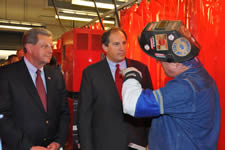 Des Moines Area Community College (DMACC) welding instructor Bill Morgan (right) visits with U.S. Congressman Tom Latham of Iowa and U.S. Deputy Labor Secretary Seth Harris during a tour of the DMACC Ankeny Campus welding lab. View the slideshow for more images and captions.