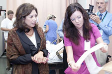 A Roane State nursing student demonstrates how to properly dress a wound in the school's training facility. View the slideshow for more images and captions.