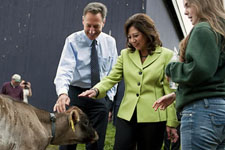Vermont Governor Peter Shumlin and Secretary Solis greet a calf at Vermont Technical College's farm in Randolph, Vt. as VTC student Rachel Arsenault talks about the school's agriculture and agri-business training programs. View the slideshow for more images and captions.