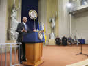 Attorney General Eric Holder delivers remarks on September 30, 2011 at the installation ceremony for Assistant Attorney Generals Virginia Seitz and Lisa Monaco, who are seated alongside Justice Elena Kagan and Judge Harry Edwards.