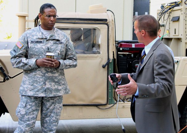 Mike Monteleone, chief, Tactical Networks Branch, CERDEC Space and Terrestrial Communications Directorate, briefs Maj. Gen. LaWarren Patterson, commanding general, Army Signal Center of Excellence, on his branch's ongoing programs during Patterson's visit to CERDEC, Sept. 25, 2012.