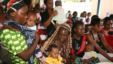 Women and their children visit a clinic at Sinza Health Centre in Tanzania