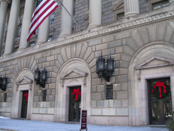 Image of the Commerce headquarters with red bows