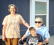 Family in front of home