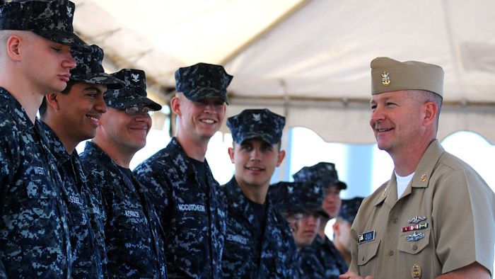 Master Chief Petty Officer of the Navy (MCPON) talks to Sailors from the USS Missouri before pinning on their Enlisted Submarine Warfare pin.