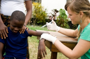 Humanitarian healthcare workers with child