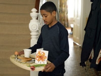 Boy carrying tray.