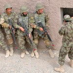 An Afghan National Army team leader course teacher instructs ANA soldiers on room clearing procedures during the urban operations training portion of the course at Camp Hero, southern Afghanistan, Apr. 12, 2012.