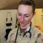 Canadian Forces Medical Technician Cpl Christine Borkowski takes measures the blood pressure of a soldier stationed at Camp Alamo in Kabul, Afghansitan. (Image by Master Cpl. Chris Ward)