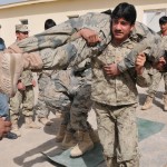 Afghan National Policemen practice manual patient carries during the trauma assistant medic course at the Joint Regional Afghan National Police Center in Southern Afghanistan. (U.S. Air Force photo by Tech. Sgt. Renee Crisostomo/Released)