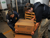 HSI special agents move evidence boxes