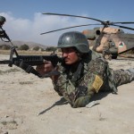 An Afghan National Army commando candidate pulls security while candidates board a Mi-17 helicopter during a training exercise at the Commando School of Excellence, Kabul province, Afghanistan, Nov. 2. The school trains Afghan National Army special forces and commando candidates advanced military techniques to enhance the Afghan elite fighting forces. (U.S. Army photo by Sgt. Dayan Neely)