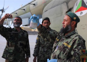 Afghan air force fuels specialists check the fuel of an Afghan Mi-17 Helicopter prior to a scheduled training flight at Kandahar Air Base, Afghanistan, April 17, 2012. The fuel samples are regularly checked for contaminates that may affect the aircraft during flight. (U.S. Air Force photo by Staff Sgt. Nadine Y. Barclay)