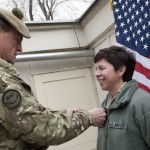 NATO Training Mission--Afghanistan Deputy Commander-Army Brig. James I.S. Stevenson and pins major rank insignia on U.S. Air Force Maj. Maria B. Heredia during a promotion ceremony at Camp Eggers.