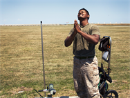 Cpl. Neil Sookdeo, a member of the Marine Corps Shooting Team, thanks the wind gods after a perfect score from the 600-yard line portion of the President’s 100 matches aboard Camp Perry, Ohio, July 30, 2012. Before shooting from the 600, Sookdeo, from Danbury, Conn., also cleaned the target with a perfect score on the 300-yard line. Sookdeo finished 7th in the President’s 100.