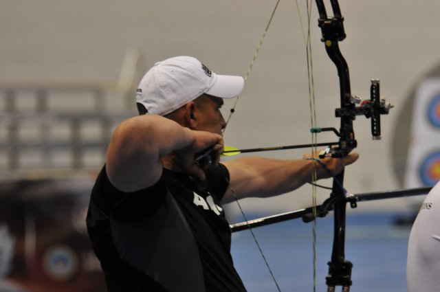 Retired Staff Sgt. Jesse White takes aim during the 2012 Warrior Games Archery Competition at the Air Force Academy in Colorado Springs, Colo. White said following the steps to hit a target in archery helped him to recover from mild traumatic brain injury.