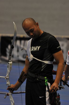 Archery team member Staff Sgt. Al Louangketh selects his next arrow during the 2012 Warrior Games archery competition at the Air Force Academy in Colorado Springs, Colo. Louangketh said he found his passion for archery when he joined the archery team in high school, and since then, he has competed.