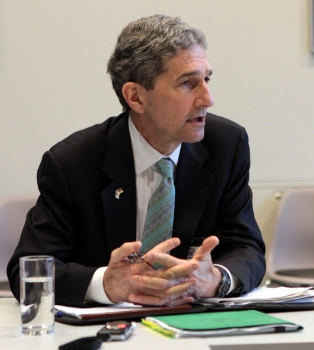 Cam Kerry seated at conference table in Berlin