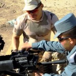 A Romanian Gendarmerie instructor (left) shows an Afghan Uniform Police noncommissioned officer how to use the Russian-made NSV 12.7 mm machine gun at the Spin Boldak ANP Training Cener Oct. 25 at Spin Boldak, Afghanistan. The Romanian Gendarmerie trained 10 ANA officers and NCOs on the NSV, PKM 7.62 millimeter Squad Automatic Weapon and the RPK light-machine gun.  (Photo by Romanian Gendarmerie Sgt. 1st Class Barbulescu Alcor)