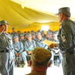 An Afghan Uniform Police recruit, left, salutes Brig. Gen. Nasrullah Zarifi, right, Afghan National Police training commander for southern Afghanistan, before receiving his completion certificate during an initial police training course graduation ceremony at the Spin Boldak Police Training Center in southern Afghanistan, May 24, 2012.