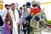 U.S. Navy Petty Officer 1st Class Theresa Richards smiles after giving a piece of candy to an Afghan girl during a mission in Farah City in Afghanistan's Farah province, Sept. 29, 2012. Richards, a hospital corpsman, is assigned to Provincial Reconstruction Team Farah. U.S. Navy photo by Lt. Benjamin Addison