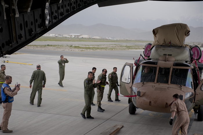 Turkish air force members clap for the U.S. Air Force C-17 Globemaster III aircrew after offloading a TURAF UH-60 Black Hawk helicopter from the C-17 May 5, 2012, at Kabul International Airport, Afghanistan. The C-17 aircrew from Joint Base McGuire-Dix-Lakehurst, N.J., transported the helicopter to Kabul from Incirlik Air Base, Turkey. The joint support mission provided smooth delivery of the helicopter to replace one that crashed December 2011.
