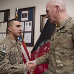 NATO Training Mission--Afghanistan Commander Lt. Gen. Daniel P. Bolger congratulates Staff Sgt. Sergio E. Servin during a promotion ceremony at Camp Eggers. Servin promoted to the rank of Air Force staff sergeant while serving a six-month tour as a member of the personal security detail team for NTM-A’s commander at Camp Eggers. (U.S. Air Force photo by Senior Airman Andrea Salazar)