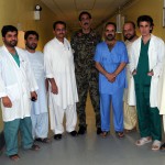 The medical staff of the Afghan National Army’s Kandahar Regional Military Hospital, who were on duty Aug. 20, 2012, pose for a photo in one of the hallways of the hospital. The hospital averages 650 hospital bed days per month. They recently expanded their capacity to 100 general admission beds, nine emergency room beds and seven intensive care unit beds. Regional Support Command-East under NATO Training Mission-Afghanistan provides mentors and trainers who assist the staff at the hospital. Photo by U.S. Army Capt. Monika Comeaux, DCOM-SPO/NTM-A PAO