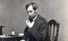 photo of Lincoln seated by Matthew Brady