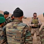 Petty Officer 2nd Class Aaron Helmer demonstrates the proper Explosive Ordnance Disposal techniques to Afghan National Army Soldiers at a safe blast site near Camp Mike Spann. (U.S. Navy photo by Mass Communications Specialist 1st Class Christophe Laurent)