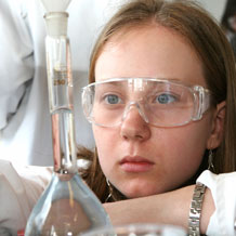 High School Girl Observing Beaker