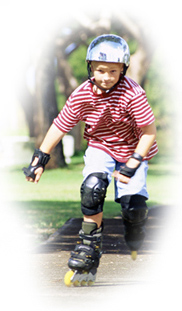 boy on skates on sidewalk