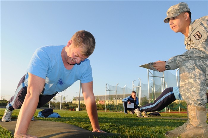 German Soldiers complete the push-up portion of the Army Physical Fitness Test July 27, as they prepare to take part in the 2011 Expert Field Medical
Badge standardization and testing at Grafenwoehr, Germany. The NATO troops will be joined later this week by nearly 300 U.S. Army and Navy medical personnel, who will vie for the coveted badge from July 31 - August 13. (U.S. Army photo by Sgt. 1st Class Christopher Fincham)