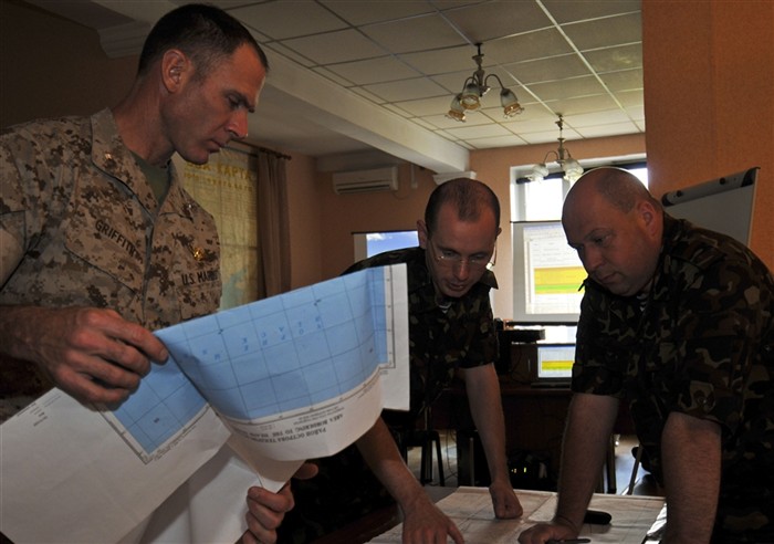 ODESSA, Ukraine (June 10, 2011)  Lt. Col. Stephen Griffith (left), Ukrainian Lt. j.g. Eugene Adamenko (Center), and Ukrainian Lt. Col. Volodimir Belskiy (right) discuss training plans for exercise Sea Breeze 2011. Air, land and naval forces from Azerbaijan, Algeria, Belgium, Denmark, Georgia, Germany, Macedonia, Moldova, Sweden, Turkey, Ukraine, the United Kingdom and the United States are participating in Sea Breeze, the largest multinational maritime exercise this year in the Black Sea, June 6-18, and is co-hosted by the Ukrainian and U.S. Navies. (U.S. Navy photo by Mass Communication Specialist 2nd Class Stephen Oleksiak)