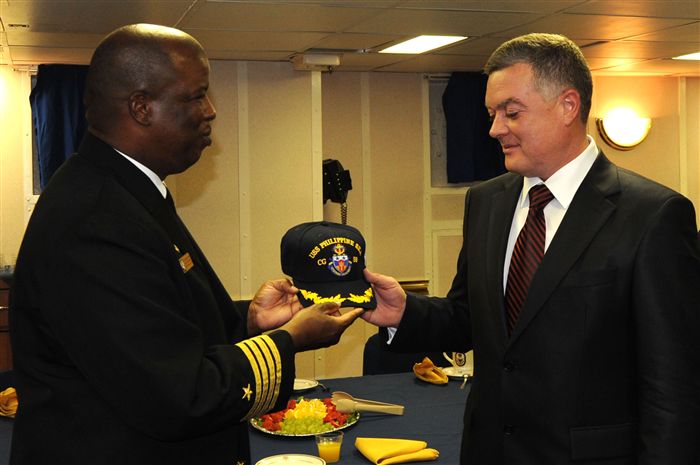 Capt. Herbert Hadley, left, commanding officer of USS Philippine Sea (CG 58), presents Mr. Viktor Yatsuba, center, mayor of Sevastopol, a command ballcap prior to a reception for Ukrainian military and civilian guests while inport Sevastopol. Philippine Sea visited Sevastopol for a three-day port visit to strengthen the military partnership between Ukraine and the United States through joint military exercises and training to build upon the collective international capabilities and enhance overall maritime domain awareness in the Black Sea. Philippine Sea is on a regularly scheduled deployment in the Black Sea and serves to promote peace and security in the U.S. 6th Fleet area of responsibility. 