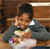 photo of young girl eating lunch in school cafeteria