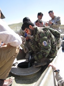 Under the supervision of Warrant Officer Eric Bouchard, a member of the Armed Forces Academy of Medical Sciences, Afghan National Army soldiers enrolled in the Preventative Medicine course check for potential health hazards in a water tank located at the Kabul Military Training Center located near Kabul, Afghanistan, 26 May 2012.