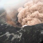 Ash cloud rising from Pu`u `Ō `ō as crater floor collapses.