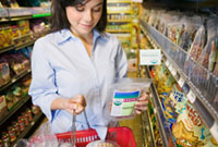 Woman holding basket making food choices