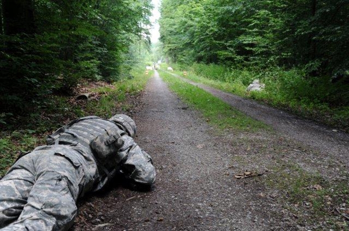 SGT Nathan Burnett reacts to incoming fire during Warrior Field Exercise (WFTX) in Boeblingen Germany. SSG Burnett is assigned to the Joint Tactical Ground Station (JTAGS) stationed at Kelley Barracks. WFTX is an annual requirement for all Soldiers.