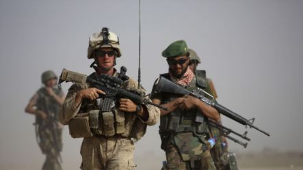 A US Marine and an Afghan soldier are seen on joint patrol in Helmand province, southern Afghanistan (file photo).