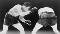 Joe Louis looks for an opening during a boxing match with Max Schmeling, 1936