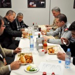 U.S. and Canadian coalition force Rotarians enjoy a meal with the president of the Kabul Rotary Club, Dost Mohammad, Jan. 29. During the first meeting of the “Unchartered Rotary Club of Camp Eggers” the group fellowshipped and discussed plans for future international engagements. (U.S. Air Force photo by Staff Sgt. Terri Barriere)