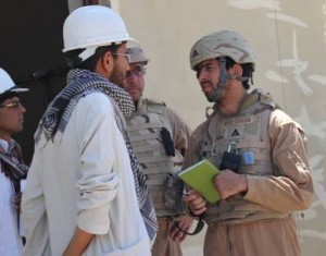 Engineer Tariq (right) and construction representative Paul Bell (center) discuss progress of construction with the contractor at a site near Adraskan.