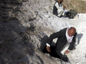 The Head of the District Development Assembly, Mohammad Amir, climbs down into a kanda being built in the Alburz Mountains, April 14, 2012. The kandas will provide fresh water for the local Afghan population. International Security Assistance Force Regional Command North supports Afghan National Security Forces in close coordination and collaboration in providing security and disrupting insurgent activities in order to protect the Afghan population.